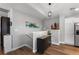 Hallway area with neutral paint, luxury vinyl flooring, and staircase to lower level at 19437 E Mann Creek Dr # A, Parker, CO 80134