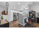 Bright kitchen featuring stainless steel appliances, white cabinetry, and hardwood flooring at 19437 E Mann Creek Dr # A, Parker, CO 80134