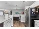 Modern kitchen featuring stainless steel appliances and hardwood flooring at 19437 E Mann Creek Dr # A, Parker, CO 80134