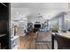 Open floor plan showcases living room with vaulted ceiling, and wood flooring at 19437 E Mann Creek Dr # A, Parker, CO 80134