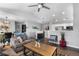 Open-concept living area with wood floors and ample seating perfect for entertaining at 19437 E Mann Creek Dr # A, Parker, CO 80134