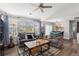 Inviting living room with comfortable seating, hardwood floors, and ample natural light at 19437 E Mann Creek Dr # A, Parker, CO 80134
