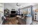 Cozy living room with large windows, wood floors, and comfortable seating area at 19437 E Mann Creek Dr # A, Parker, CO 80134