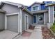 Charming home exterior featuring a well-maintained garage and inviting front door at 11009 Gaylord. St, Northglenn, CO 80233