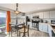 Eat-in kitchen featuring modern appliances, a breakfast nook, and outdoor access at 11009 Gaylord. St, Northglenn, CO 80233