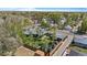 Aerial view of a home surrounded by lush greenery in a quiet neighborhood at 8955 E 19Th Ave, Aurora, CO 80010