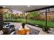 Serene backyard patio with modern seating, lush landscaping, and a tranquil ambiance, ideal for relaxation and entertaining at 8955 E 19Th Ave, Aurora, CO 80010