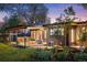 Inviting covered patio and landscaped backyard featuring lounge furniture, perfect for outdoor relaxation at 8955 E 19Th Ave, Aurora, CO 80010