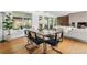 Contemporary dining room features sleek furniture and hardwood floors with natural light at 8955 E 19Th Ave, Aurora, CO 80010