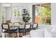 Bright dining area featuring modern chairs, a sleek table, and ample natural light at 8955 E 19Th Ave, Aurora, CO 80010