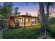 Backyard with covered patio, providing the perfect place to relax while enjoying the evening sunset at 8955 E 19Th Ave, Aurora, CO 80010