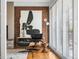 Chic living room showcasing a modern chair, artistic decor, and hardwood floors for a sophisticated, comfortable space at 8955 E 19Th Ave, Aurora, CO 80010