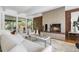 Inviting living room features a brick fireplace, comfortable seating, and lots of natural light at 8955 E 19Th Ave, Aurora, CO 80010