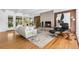 Bright and spacious living room with a cozy fireplace and modern furnishings at 8955 E 19Th Ave, Aurora, CO 80010