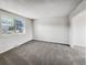 Spacious bedroom with neutral carpet and a large multi-pane window at 9065 Cody Ct, Broomfield, CO 80021