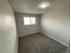 Bedroom with neutral walls, gray carpet and natural lighting at 9065 Cody Ct, Broomfield, CO 80021