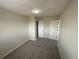 Bedroom with neutral colored walls and multiple doors at 9065 Cody Ct, Broomfield, CO 80021