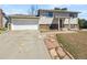 Two-story home featuring a two car garage and partial brick facade at 9065 Cody Ct, Broomfield, CO 80021