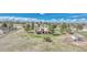 Rear aerial view of a home with a tiered deck and large yard with mature trees and partial fencing at 2188 Savage Rd, Elizabeth, CO 80107