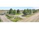 Aerial view showcases the long driveway and lush greenery surrounding this beautiful home at 2188 Savage Rd, Elizabeth, CO 80107