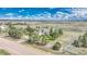 Expansive home on a lush lot, with mature trees and a stunning view of the surrounding countryside at 2188 Savage Rd, Elizabeth, CO 80107