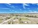 Aerial view of scattered houses, roads, and open land under a blue sky with scattered clouds at 2188 Savage Rd, Elizabeth, CO 80107