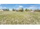 Spacious backyard with lawn, deck, and garden area provides outdoor living and entertainment at 2188 Savage Rd, Elizabeth, CO 80107