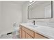 Modern half-bathroom with a sleek vanity, marble countertop, elegant fixtures, and a contemporary design at 2188 Savage Rd, Elizabeth, CO 80107