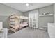 Charming ' bedroom with bunk beds, a small table, and ample storage, perfect for play and rest at 2188 Savage Rd, Elizabeth, CO 80107