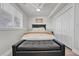 Cozy bedroom with a comfortable bed, soft lighting, and ample closet space at 2188 Savage Rd, Elizabeth, CO 80107