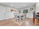 Inviting dining room features wood floors, classic wainscoting, and a stylish table set for a cozy meal at 2188 Savage Rd, Elizabeth, CO 80107