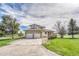 Charming two-story home featuring a three-car garage, well-manicured lawn, and inviting curb appeal at 2188 Savage Rd, Elizabeth, CO 80107