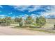 Beautiful front yard with mature trees enhances the curb appeal of this lovely home at 2188 Savage Rd, Elizabeth, CO 80107