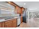 Bright kitchen featuring granite counters, stainless steel appliances, and views of the outdoors at 2188 Savage Rd, Elizabeth, CO 80107