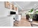 Bright home office featuring a sleek white desk, modern chair, and ample natural light at 2188 Savage Rd, Elizabeth, CO 80107