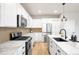 Well-appointed kitchen with marble countertops, stainless steel appliances, and ample cabinet space for storage at 10906 Pastel Pt, Parker, CO 80134
