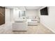 Cozy finished basement featuring a sectional sofa, carpet, and a barn door accent at 10906 Pastel Pt, Parker, CO 80134