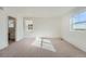 Light filled bedroom with carpeted floors and large windows at 728 N Clubview St, Watkins, CO 80137