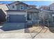 Charming two-story home featuring a stone facade and a two-car garage at 728 N Clubview St, Watkins, CO 80137