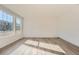 Bright living room with hardwood floors and large windows allowing lots of natural light at 728 N Clubview St, Watkins, CO 80137