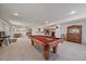 Finished basement with pool table, bar, and dining area, perfect for entertaining at 21753 E Heritage Pkwy, Aurora, CO 80016