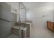 Bright bathroom with a glass-enclosed shower and a soaking tub at 21753 E Heritage Pkwy, Aurora, CO 80016
