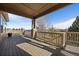 Open back deck offering ample space for outdoor seating and beautiful backyard views at 21753 E Heritage Pkwy, Aurora, CO 80016