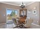Bright dining area with a sliding door to a deck and backyard view at 21753 E Heritage Pkwy, Aurora, CO 80016