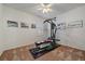 Bright exercise room features carpeted floors, a ceiling fan, and a Bowflex exercise machine at 21753 E Heritage Pkwy, Aurora, CO 80016