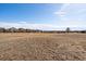 Scenic view of the community golf course, surrounded by houses and a beautiful blue sky at 21753 E Heritage Pkwy, Aurora, CO 80016