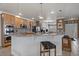 Eat-in kitchen with granite countertops, stainless steel appliances, and an island with bar seating at 21753 E Heritage Pkwy, Aurora, CO 80016