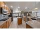 Modern kitchen with granite countertops, stainless steel appliances, an island and lots of cabinet space at 21753 E Heritage Pkwy, Aurora, CO 80016