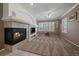 Cozy living room with a fireplace and a large window for natural light at 21753 E Heritage Pkwy, Aurora, CO 80016