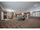 An open-concept layout with a view of the kitchen, living area, and dining area, perfect for entertaining at 21753 E Heritage Pkwy, Aurora, CO 80016